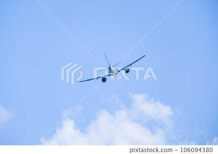 Airplane taking off with blue sky 106094380