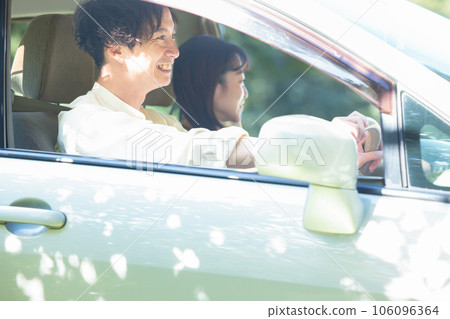 A couple enjoying drive 106096364