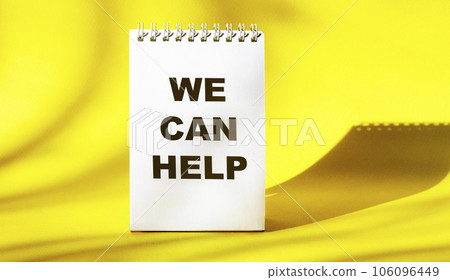 We can help text on white notepad and yellow background 106096449