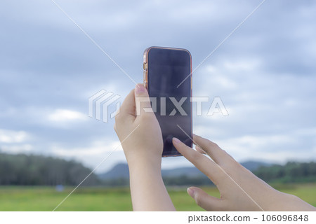 Women with smartphone mobile camera photograph and online social network Women with smartphone mobile camera photograph and online social network 106096848