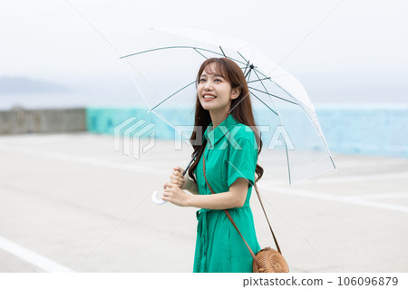 Cute woman taking a walk on a rainy day 106096879