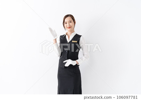 Woman in uniform, white gloves, holding hands 106097781