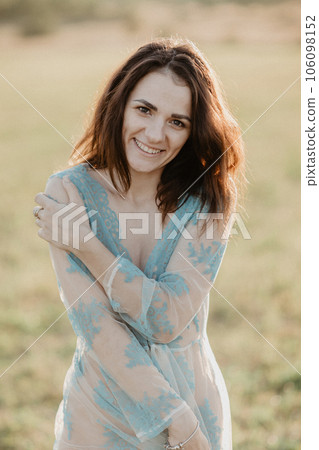 happy sexy young topless nude girl smiling in field in summer. Added the effect of a small film grain 106098152