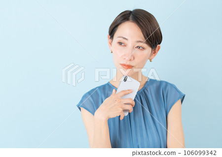 Woman holding a smartphone Woman holding a smartphone 106099342