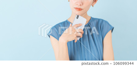 Woman holding a smartphone Woman holding a smartphone 106099344