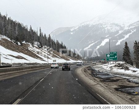 driving on highway through colorado rockies 106100928