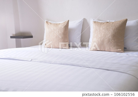 white cozy bedroom, decor idea and design, home interior decoration. light brown pillow side view 106102556