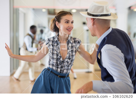 Woman and man dancing swing in studio 106102620