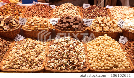 Nuts and dried fruits on the counter in the market Nuts and dried fruits on the counter in the market 106102631