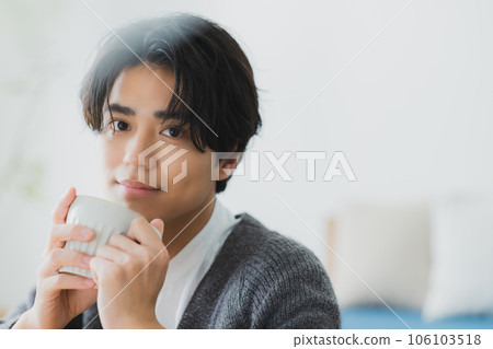 Man drinking coffee Man drinking coffee 106103518