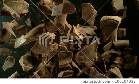 Freeze Motion Shot of Exploding Chocolate Chunks, Macro Shot Freeze Motion Shot of Exploding Chocolate Chunks, Macro Shot 106104382