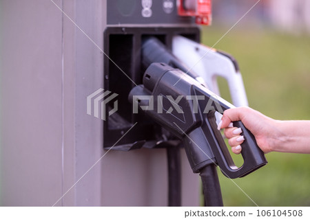 Electric Vehicle (EV) Charging Station with Ev Vehicle Power Cable Power Plug. NFC payment. Smart Energy Electric Vehicle (EV) Charging Station with Ev Vehicle Power Cable Power Plug. NFC payment. Smart Energy 106104508