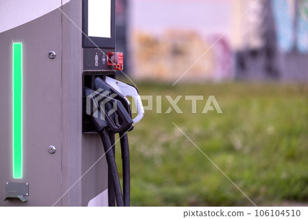 Electric Vehicle (EV) Charging Station with Ev Vehicle Power Cable Power Plug. NFC payment. Smart Energy Electric Vehicle (EV) Charging Station with Ev Vehicle Power Cable Power Plug. NFC payment. Smart Energy 106104510