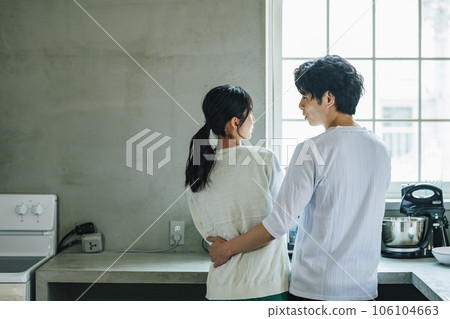 Couple having a conversation in the kitchen at home Couple having a conversation in the kitchen at home 106104663
