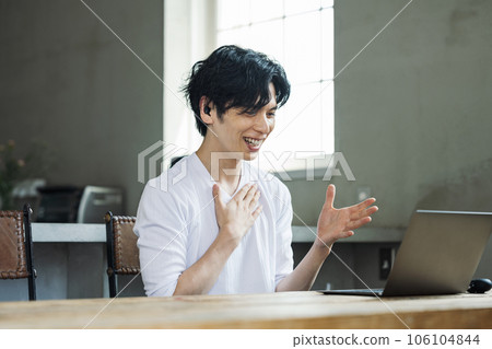 man learning language online 106104844