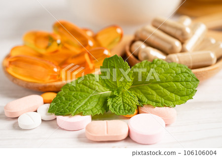 Alternative medicine herbal organic capsule with vitamin E omega 3 fish oil, mineral, drug with herbs leaf natural supplements for healthy good life. Alternative medicine herbal organic capsule with vitamin E omega 3 fish oil, mineral, drug with herbs leaf natural supplements for healthy good life. 106106004