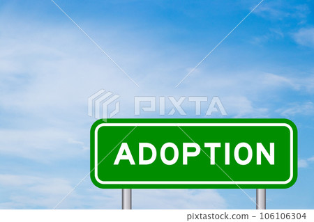 Green color transportation sign with word adoption on blue sky with white cloud background Green color transportation sign with word adoption on blue sky with white cloud background 106106304