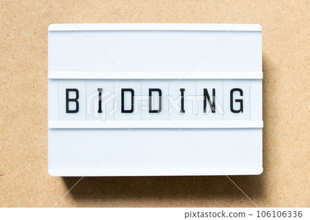 Lightbox with word bidding on wood background Lightbox with word bidding on wood background 106106336