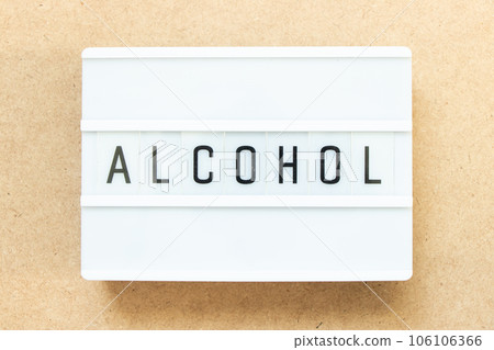Lightbox with word alochol on wood background 106106366