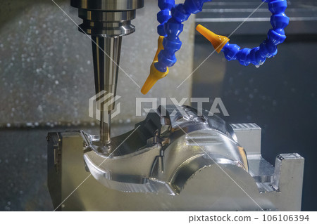 The CNC milling machine cutting injection mold part by solid ball end mill tool in the light blue scene. 106106394