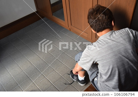 Elderly people tying shoelaces Elderly people tying shoelaces 106106794