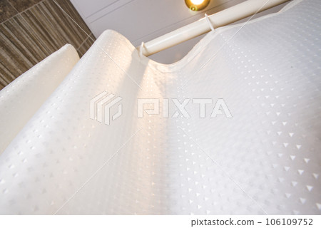 An interior bathroom table with a white mosaic tiles wall. Background for design products. Wall tiles. 106109752