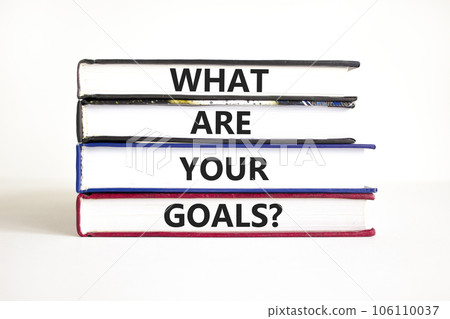 What are your goals symbol. Concept words What are your goals on books. Beautiful white table white background. Business psychological what are your goals concept. Copy space What are your goals symbol. Concept words What are your goals on books. Beautiful white table white background. Business psychological what are your goals concept. Copy space 106110037