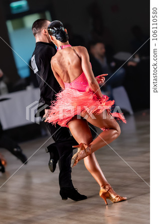 a couple dance a Latin dance. the legs of a dancing couple 106110580