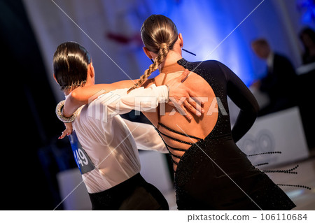 a couple dance a Latin dance. the legs of a dancing couple a couple dance a Latin dance. the legs of a dancing couple 106110684