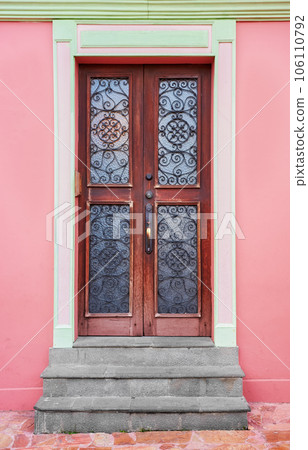Street view of a colorful facade with door, architecture background, Guayaquil, Ecuador. 106110792