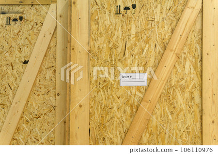 transport box, ready for dispatch, made of chipboard and boards with an attached label with an order number transport box, ready for dispatch, made of chipboard and boards with an attached label with an order number 106110976