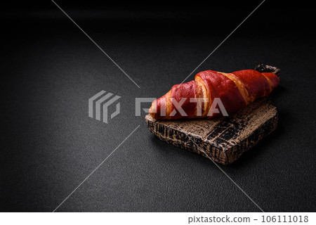 Delicious sweet crunchy red croissant with cream filling 106111018