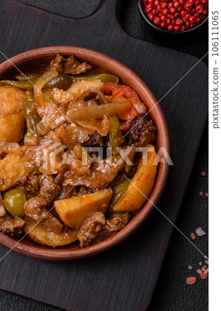 Delicious fresh stew of potatoes, tomatoes, onions, carrots and beef 106111065