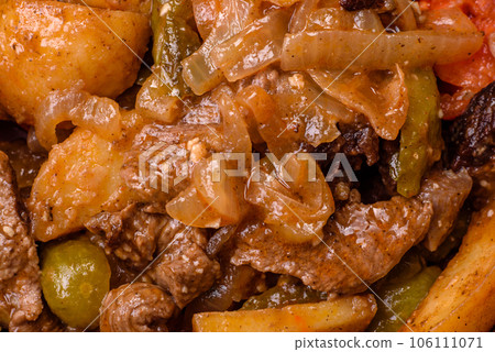 Delicious fresh stew of potatoes, tomatoes, onions, carrots and beef 106111071