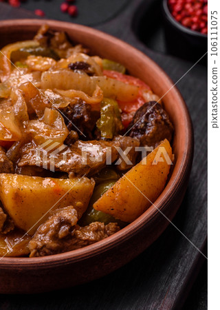 Delicious fresh stew of potatoes, tomatoes, onions, carrots and beef 106111075