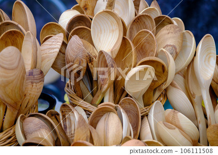 lot of hand made wooden kitchen utensils, Wooden spoons, spatulas sold on the street market. 106111508