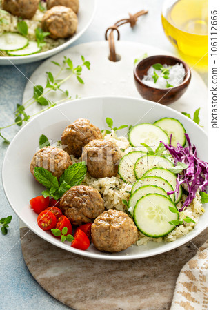 Healthy lunch bowl with meatballs and cauliflower rice Healthy lunch bowl with meatballs and cauliflower rice 106112666