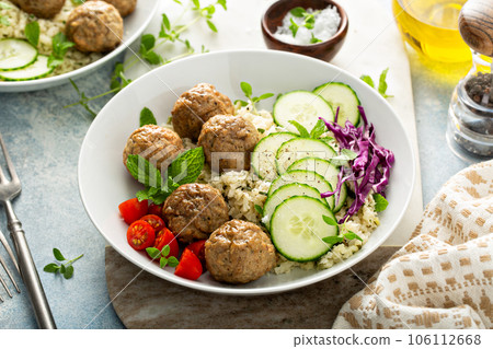 Healthy lunch bowl with meatballs and cauliflower rice Healthy lunch bowl with meatballs and cauliflower rice 106112668