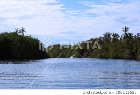Motor boat travels up the a river in Acapulco, Mexico Motor boat travels up the a river in Acapulco, Mexico 106112683