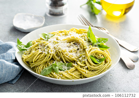 Basil pesto pasta with parmesan and olive oil Basil pesto pasta with parmesan and olive oil 106112732