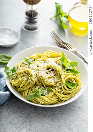 Basil pesto pasta with parmesan and olive oil Basil pesto pasta with parmesan and olive oil 106112734