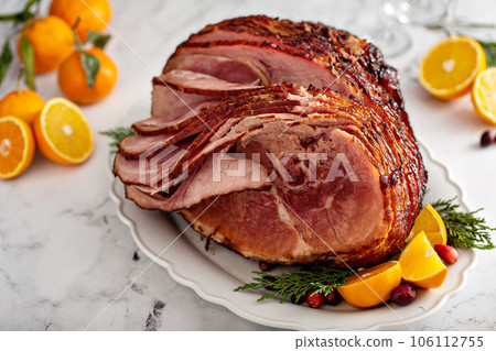 Spiral sliced Christmas ham with orange honey glaze Spiral sliced Christmas ham with orange honey glaze 106112755