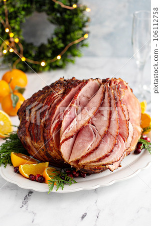 Spiral sliced Christmas ham with orange honey glaze Spiral sliced Christmas ham with orange honey glaze 106112758