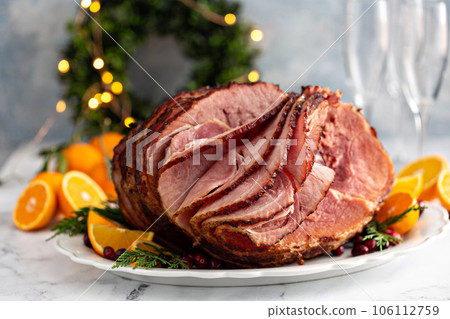 Spiral sliced Christmas ham with orange honey glaze Spiral sliced Christmas ham with orange honey glaze 106112759