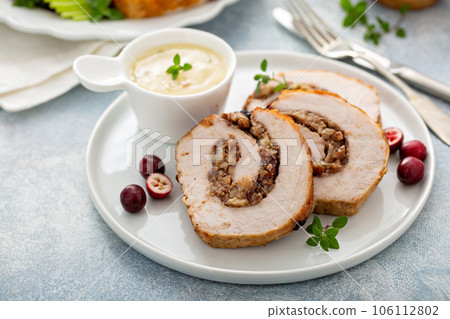 Stuffed roasted pork loin stuffed with apple stuffing Stuffed roasted pork loin stuffed with apple stuffing 106112802