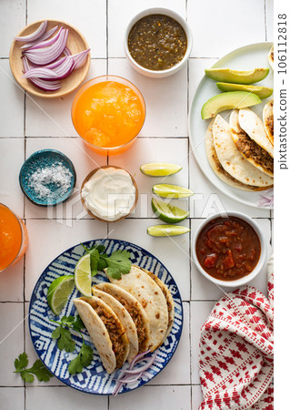 Baked tacos with pulled chicken and cheese Baked tacos with pulled chicken and cheese 106112818