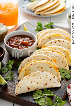 Baked tacos with pulled chicken and cheese 106112829