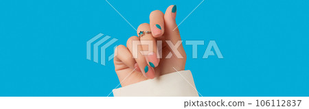 Womans hand with blue manicure. Trendy spring summer nail design 106112837