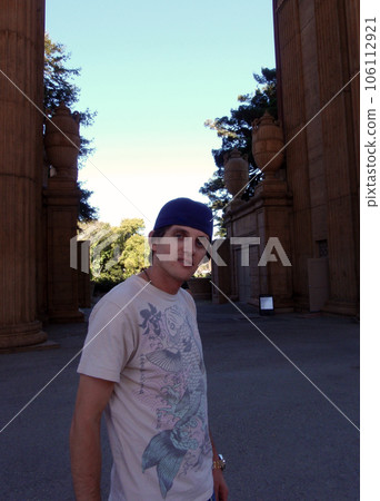 cool twentysome thing male strikes a pose while wear his hat backwards cool twentysome thing male strikes a pose while wear his hat backwards 106112921