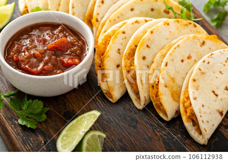 Baked tacos with pulled chicken and cheese 106112938